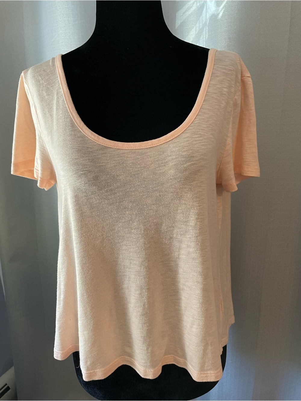Delia’s size m Scoop Neck Short Sleeve Drape Back Top in Pale Peach cotton blend